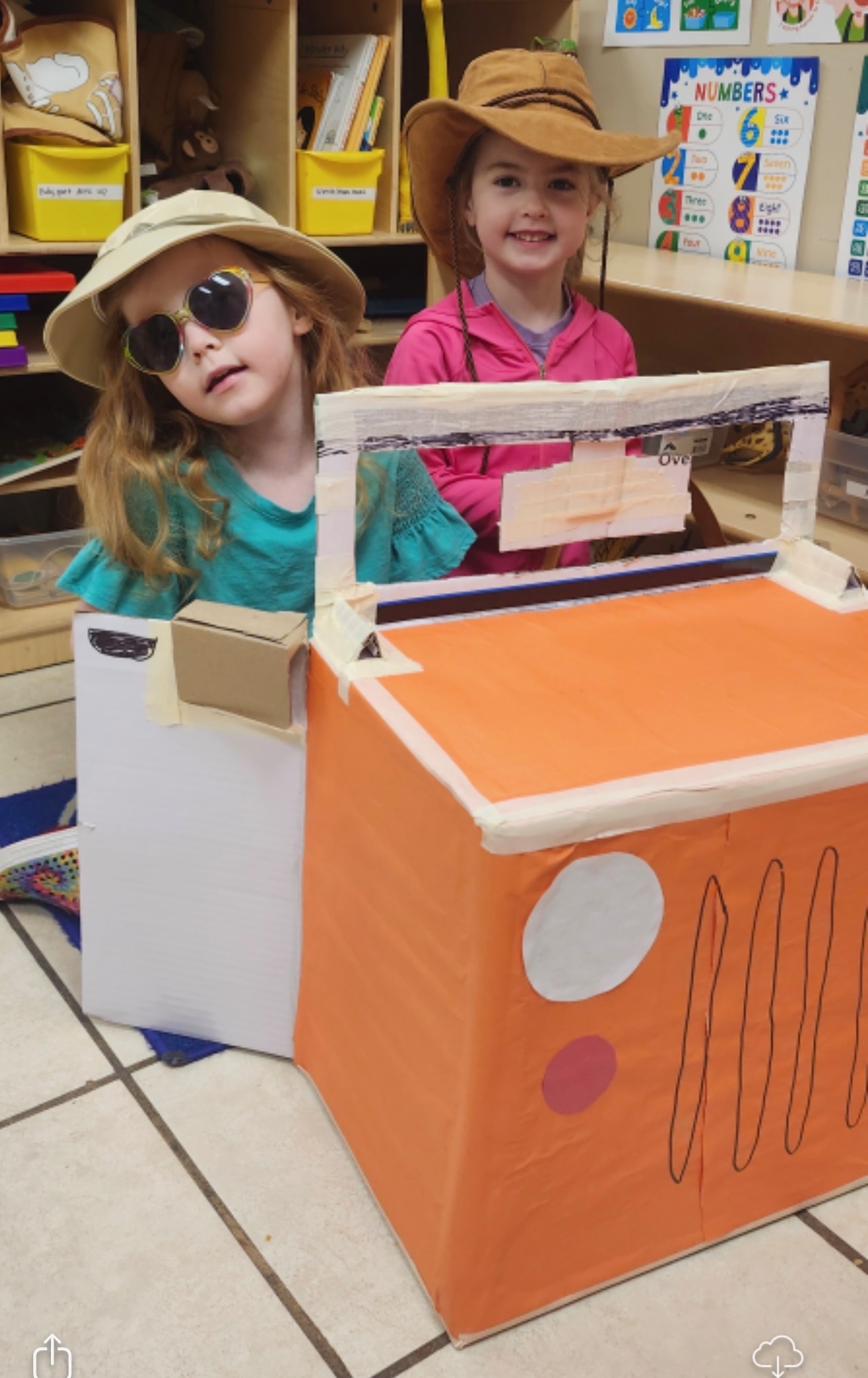 Children enjoying pretend play in the classroom